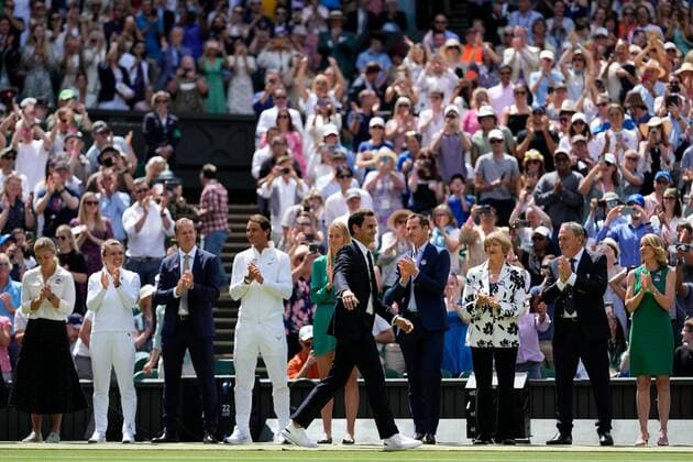 Mandatory Credit: Photo by Dave Shopland Shutterstock (13012855d) Roger Federer walks past former Champions on Centre Court as part of the centenary celebrations Wimbledon Tennis Championships, Day 7, The All England Lawn Tennis and Croquet Club, London, UK - 03 Jul 2022 Wimbledon Tennis Championships, Day 7, The All England Lawn Tennis and Croquet Club, London, UK - 03 Jul 2022  Copyright: xDavexShopland Shutterstockx 13012855d