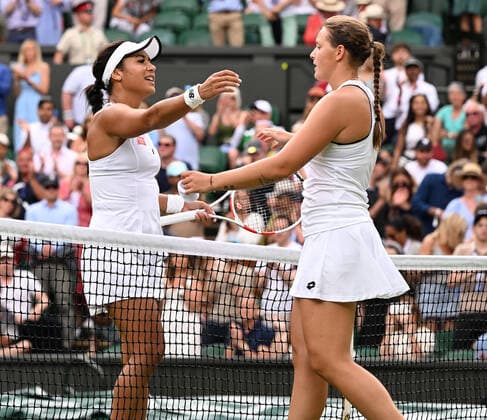 Tennis Championships - Week One - Day Seven - All England Lawn Tennis Club, Wimbledon - Sunday 3rd July 2022 Jule Niemeier (GER) v Heather Watson (GBR) Heather Watson congratulates winner Jule Niemeier of Germany at the net 