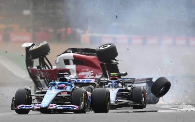 3rd July 2022, Silverstone Circuit, Silverstone, Northamptonshire, England: British F1 Grand Prix, Race day: Zhou Guanyu of China driving the (24) Alfa Romeo F1 C42 Ferrari is hit at the start and his car begins to roll over down the track  ActionPlus12404610 SimonxWest
