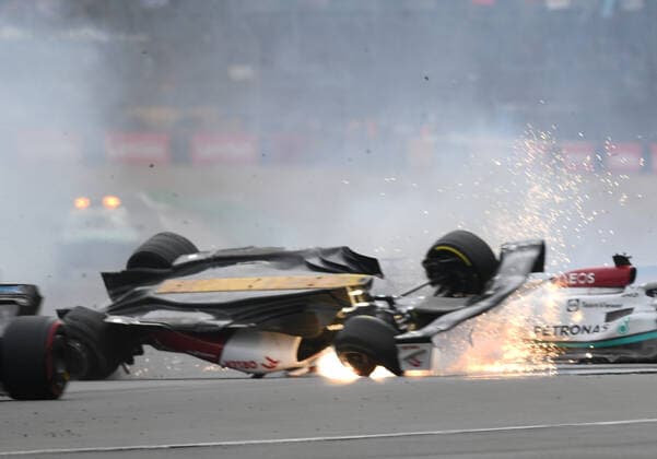 3rd July 2022, Silverstone Circuit, Silverstone, Northamptonshire, England: British F1 Grand Prix, Race day: Zhou Guanyu of China driving the (24) Alfa Romeo F1 C42 Ferrari is hit at the start and his car begins to roll over down the track  ActionPlus12404612 SimonxWest