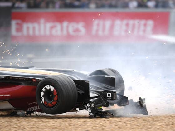 3rd July 2022, Silverstone Circuit, Silverstone, Northamptonshire, England: British F1 Grand Prix, Race day: Zhou Guanyu of China driving the (24) Alfa Romeo F1 C42 Ferrari is hit at the start and his car rolls, sliding upside down towards the barriers and gravel  ActionPlus12404626 SimonxWest