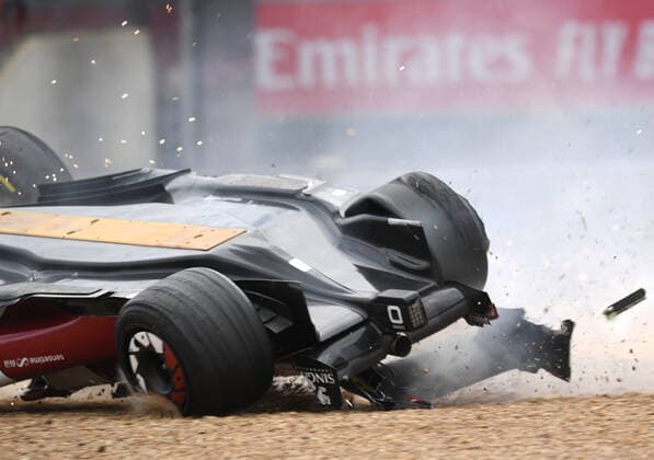 3rd July 2022, Silverstone Circuit, Silverstone, Northamptonshire, England: British F1 Grand Prix, Race day: Zhou Guanyu of China driving the (24) Alfa Romeo F1 C42 Ferrari is hit at the start and his car rolls into the gravel  ActionPlus12404627 SimonxWest