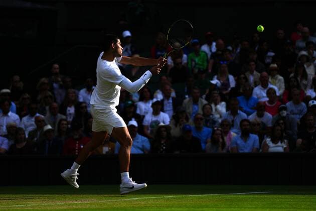 Mandatory Credit: Photo by Javier Garcia Shutterstock (13012857gv) Carlos Alcaraz during his fourth round match Wimbledon Tennis Championships, Day 7, The All England Lawn Tennis and Croquet Club, London, UK - 03 Jul 2022 Wimbledon Tennis Championships, Day 7, The All England Lawn Tennis and Croquet Club, London, UK - 03 Jul 2022  Copyright: xJavierxGarcia Shutterstockx 13012857gv