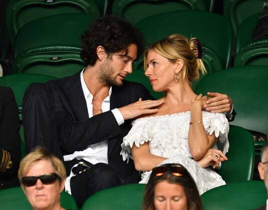 Mandatory Credit: Photo by James Veysey Shutterstock (13012856fr) Sienna Miller and Oli Green watching the action on Centre Court Wimbledon Tennis Championships, Day 7, The All England Lawn Tennis and Croquet Club, London, UK - 03 Jul 2022 Wimbledon Tennis Championships, Day 7, The All England Lawn Tennis and Croquet Club, London, UK - 03 Jul 2022  Copyright: xJamesxVeysey Shutterstockx 13012856fr