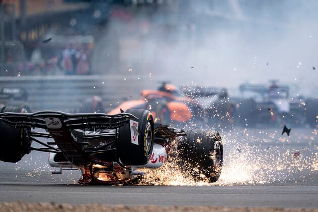 July 3, 2022, Towcester, United Kingdom: Chinese driver ZHOU GUANYU (Alfa Romeo Racing) crashes at the start of the 2022 FIA Formula 1 British Grand Prix at Silverstone Circuit. The race had to be restarted after Zhou s car was flipped upside down and crashed into a fence having been clipped shortly after the start. Towcester United Kingdom - ZUMAg147 20220703_zap_g147_009 Copyright: xJamesxGasperottix