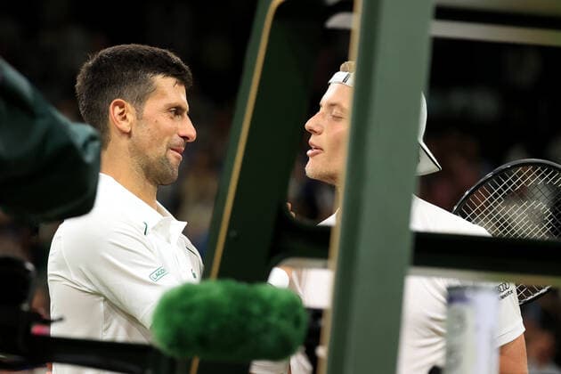 Tennis - Wimbledon (Day 7) 3rd July 2022 - Tennis - Wimbledon (Day 7) - Gentlemen s Singles Round of 16 match - Novak Djokovic (SRB) v Tim Van Rijthoven (NED) - Novak Djokovic consoles van Rijthoven after the four sets victory. Photo: Simon Stacpoole Offside. London UK Copyright: xSimonxStacpoolexOffside