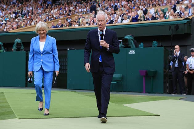 Tennis - Wimbledon (Day 7) 3rd July 2022 - Tennis - Wimbledon (Day 7) - Television presenters John McEnroe and Sue Barker walk onto Centre Court - Photo: Simon Stacpoole Offside. London UK Copyright: xSimonxStacpoolexOffside