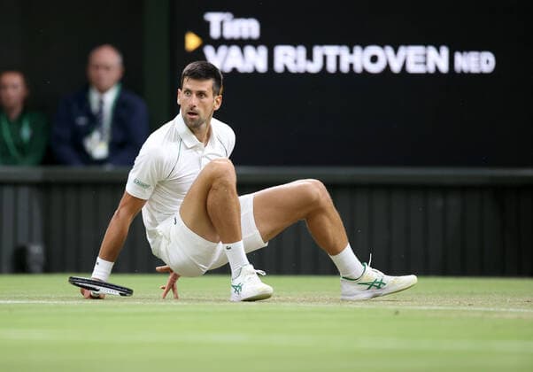 (220704) -- LONDON, July 4, 2022 -- Novak Djokovic of Serbia reacts during the men s singles fourth round match against Tim Van Rijthoven of the Netherland at Wimbledon tennis Championship in London, Britain, on July 3, 2022. ) (SP)BRITAIN-LONDON-TENNIS-WIMBLEDON-MEN S SINGLES LixYing 