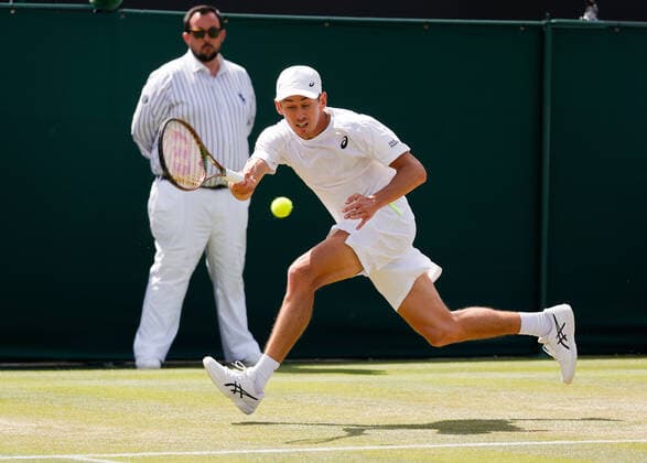 4th July 2022, All England Lawn Tennis and Croquet Club, London, England; Wimbledon Tennis tournament; Alexde Minaur (AUS) plays a forehand to Cristian Garin (CHL)  ActionPlus12405059 JohnxPatrickxFletcher