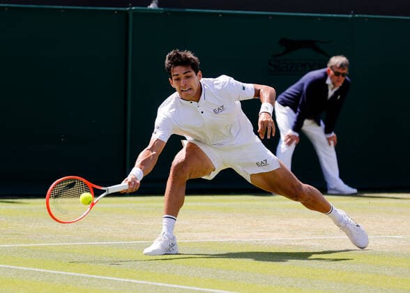 4th July 2022, All England Lawn Tennis and Croquet Club, London, England; Wimbledon Tennis tournament; Cristian Garin (CHL) plays a forehand to Alexde Minaur (AUS)  ActionPlus12405061 JohnxPatrickxFletcher