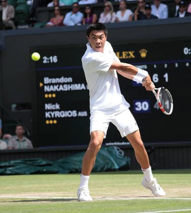 American Brandon Nakashima in action in his fourth round match against Australian Nick Kyrgios on day eight of the 2022 Wimbledon championships in London on Monday, July 04, 2022.  LON2022070416 HUGOxPHILPOTT