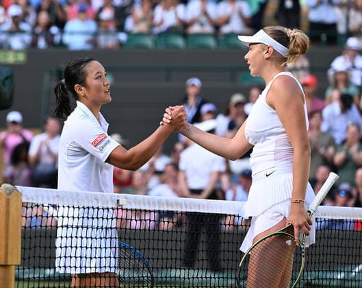 Tennis Championships - Week One - Day Eight - All England Lawn Tennis Club, Wimbledon - Monday 4th July 2022 Amanda Anisimova (USA) v Harmony Tan (FRA) Harmony Tan congratulates Amanda Anisimova at the net 