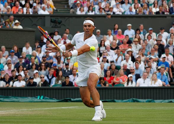 4th July 2022, All England Lawn Tennis and Croquet Club, London, England; Wimbledon Tennis tournament; Rafael Nadal (ESP) plays a backhand to Botic Van De Zandschulp (NED)  ActionPlus12405201 JohnxPatrickxFletcher