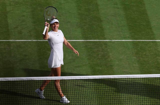 (220705) -- LONDON, July 5, 2022 -- Simona Halep of Romania celebrates after the women s singles fourth round match against Paula Badosa of Spain at Wimbledon Tennis Championship in London, Britain, on July 4, 2022. ) (SP)BRITAIN-LONDON-TENNIS-WIMBLEDON-WOMEN S SINGLES HanxYan 
