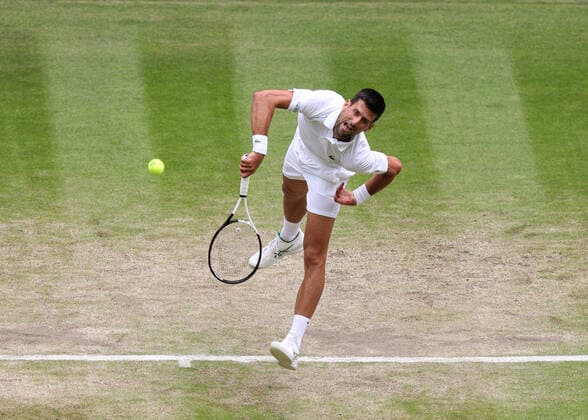 5th July 2022, All England Lawn Tennis and Croquet Club, London, England; Wimbledon Tennis tournament; Novak Djokovic (SRB) serves to Jannik Sinner (ITA) mens singles quarter-final  ActionPlus12405252 JohnxPatrickxFletcher