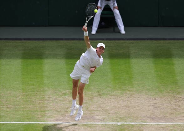 5th July 2022, All England Lawn Tennis and Croquet Club, London, England; Wimbledon Tennis tournament; Jannik Sinner (ITA) serves to Novak Djokovic (SRB) mens singles quarter-final  ActionPlus12405254 JohnxPatrickxFletcher