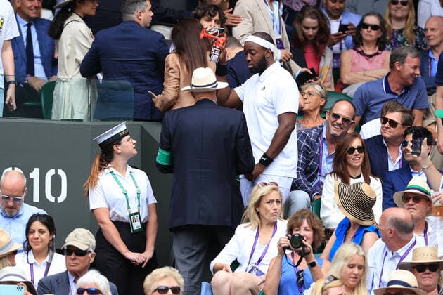 Tennis - Wimbledon (Day 9) 5th July 2022 - Tennis - Wimbledon (Day 9) - Stewards speak to a man in the crowd holding an air horn as he watches the Gentlemen s Singles Quarter Final match between Jannik Sinner (ITA) and Novak Djokovic (SRB) - Photo: Simon Stacpoole Offside. London UK Copyright: xSimonxStacpoolexOffside