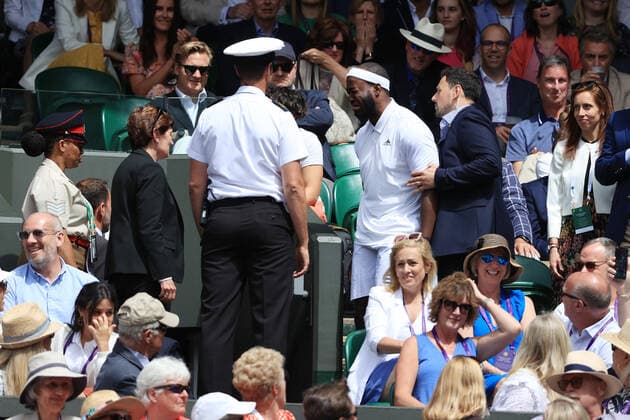 Sport Bilder des Tages Tennis - Wimbledon (Day 9) 5th July 2022 - Tennis - Wimbledon (Day 9) - Stewards remove a spectator from the crowd during the Gentlemen s Singles Quarter Final match between Jannik Sinner (ITA) and Novak Djokovic (SRB) - Photo: Simon Stacpoole Offside. London UK Copyright: xSimonxStacpoolexOffside