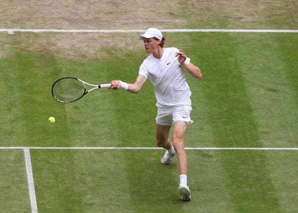 5th July 2022, All England Lawn Tennis and Croquet Club, London, England; Wimbledon Tennis tournament; Jannik Sinner (ITA) plays a forehand to Novak Djokovic (SRB)  ActionPlus12405263 JohnxPatrickxFletcher