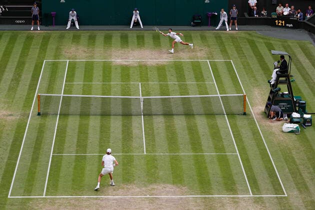 5th July 2022, All England Lawn Tennis and Croquet Club, London, England; Wimbledon Tennis tournament; Novak Djokovic (SRB) plays a forehand to Jannik Sinner (ITA) on Centre Court  ActionPlus12405272 JohnxPatrickxFletcher