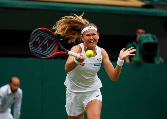 5th July 2022, All England Lawn Tennis and Croquet Club, London, England; Wimbledon Tennis tournament; Marie Bouzkova (CZE) plays a forehand to Ons Jabeur (TUN)  ActionPlus12405331 JohnxPatrickxFletcher