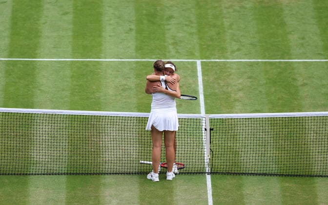(220706) -- LONDON, July 6, 2022 -- Tatjana Maria (R) of Germany hugs her compatriot Jule Niemeier after their women s singles quarter-final match at Wimbledon Tennis Championship in London, Britain, on July 5, 2022. ) (SP)BRITAIN-LONDON-TENNIS-WIMBLEDON-WOMEN S SINGLES-QUARTERFINALS HanxYan 