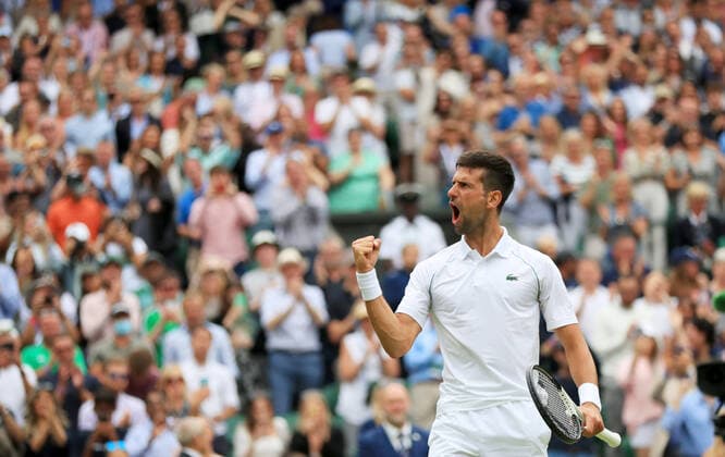 (220706) -- LONDON, July 6, 2022 -- Novak Djokovic of Serbia celebrates after winning the men s singles quarter-final match against Jannik Sinner of Italy at Wimbledon Tennis Championship in London, Britain, on July 5, 2022. ) (SP)BRITAIN-LONDON-TENNIS-WIMBLEDON-MEN S SINGLES-QUARTERFINALS LixYing 