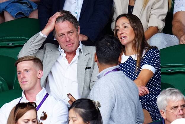 Mandatory Credit: Photo by Javier Garcia Shutterstock (13018042bv) Hugh Grant and Anna Elisabet Eberstein watching the action on Centre Court Wimbledon Tennis Championships, Day 10, The All England Lawn Tennis and Croquet Club, London, UK - 06 Jul 2022 Wimbledon Tennis Championships, Day 10, The All England Lawn Tennis and Croquet Club, London, UK - 06 Jul 2022  Copyright: xJavierxGarcia Shutterstockx 13018042bv