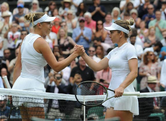 Tennis Championships - Week One - Day Ten - All England Lawn Tennis Club, Wimbledon - Wednesday 6th July 2022 Womens Singles. Simona Halep (ROU) v Amanda Anisimova (USA) Simona Halep with Amanda Anisimova at the net after the match 