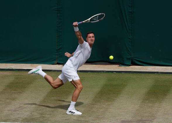 6th July 2022, All England Lawn Tennis and Croquet Club, London, England; Wimbledon Tennis tournament; Joe Salisbury (GBR) plays a backhand to Nicolas Mahut (FRA)  ActionPlus12405398 JohnxPatrickxFletcher