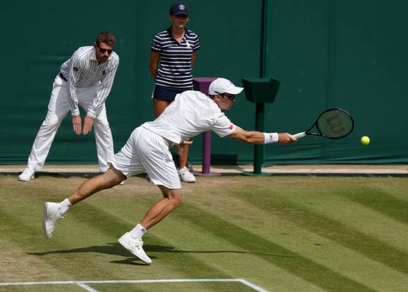 6th July 2022, All England Lawn Tennis and Croquet Club, London, England; Wimbledon Tennis tournament; Matthew Ebden (AUS) plays a backhand to John Peers (AUS)  ActionPlus12405409 JohnxPatrickxFletcher