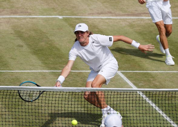 6th July 2022, All England Lawn Tennis and Croquet Club, London, England; Wimbledon Tennis tournament; Max Purcell (AUS) plays a forehand to John Peers (AUS)  ActionPlus12405424 JohnxPatrickxFletcher