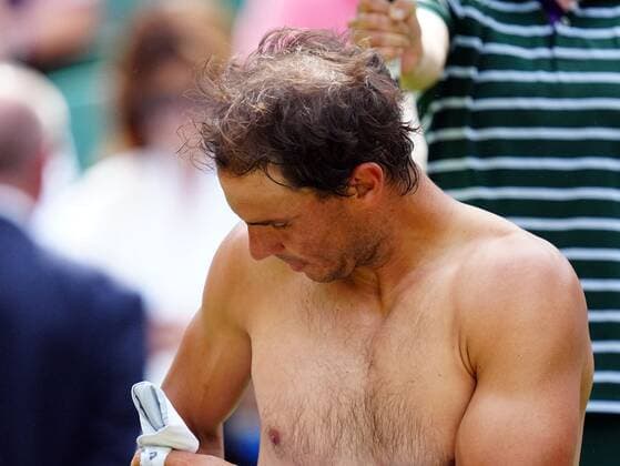 Mandatory Credit: Photo by Javier Garcia Shutterstock (13018042ge) Rafael Nadal changes his shirt during his quarter-final match Wimbledon Tennis Championships, Day 10, The All England Lawn Tennis and Croquet Club, London, UK - 06 Jul 2022 Wimbledon Tennis Championships, Day 10, The All England Lawn Tennis and Croquet Club, London, UK - 06 Jul 2022  Copyright: xJavierxGarcia Shutterstockx 13018042ge