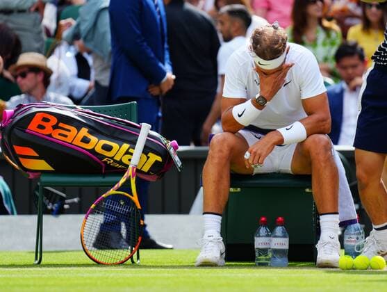 Mandatory Credit: Photo by Javier Garcia Shutterstock (13018042hc) Rafael Nadal takes a medical time out for a stomach muscle complaint during his quarter-final match Wimbledon Tennis Championships, Day 10, The All England Lawn Tennis and Croquet Club, London, UK - 06 Jul 2022 Wimbledon Tennis Championships, Day 10, The All England Lawn Tennis and Croquet Club, London, UK - 06 Jul 2022  Copyright: xJavierxGarcia Shutterstockx 13018042hc