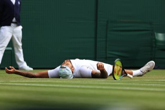 Sport Bilder des Tages Tennis - Wimbledon (Day 10) 6th July 2022 - Tennis - Wimbledon (Day 10) - Nick Kyrgios v Cristian Garin - Kyrgios lies flat out after his victory - Photo: Simon Stacpoole Offside. London UK Copyright: xSimonxStacpoolexOffside