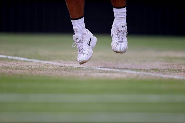 (220707) -- LONDON, July 7, 2022 -- Rafael Nadal of Spain competes during the men s singles quarter-final match against Taylor Fritz of the United States at Wimbledon Tennis Championship in London, Britain, on July 6, 2022. ) (SP)BRITAIN-LONDON-TENNIS-WIMBLEDON-MEN S SINGLES-QUARTERFINALS LixYing 