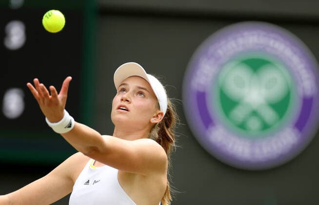 (220707) -- LONDON, July 7, 2022 -- Elena Rybakina of Kazakhstan serves during the women s singles quarter-final match against Ajla Tomljanovic of Australia at Wimbledon Tennis Championship in London, Britain, on July 6, 2022. ) (SP)BRITAIN-LONDON-TENNIS-WIMBLEDON-WOMEN S SINGLES-QUARTERFINALS LixYing 