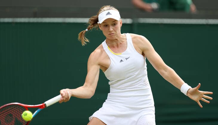 (220707) -- LONDON, July 7, 2022 -- Elena Rybakina of Kazakhstan hits a return during the women s singles quarter-final match against Ajla Tomljanovic of Australia at Wimbledon Tennis Championship in London, Britain, on July 6, 2022. ) (SP)BRITAIN-LONDON-TENNIS-WIMBLEDON-WOMEN S SINGLES-QUARTERFINALS LixYing 