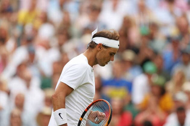 (220707) -- LONDON, July 7, 2022 -- Rafael Nadal of Spain reacts during the men s singles quarter-final match against Taylor Fritz of the United States at Wimbledon Tennis Championship in London, Britain, on July 6, 2022. ) (SP)BRITAIN-LONDON-TENNIS-WIMBLEDON-MEN S SINGLES-QUARTERFINALS LixYing 