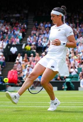 Mandatory Credit: Photo by Javier Garcia Shutterstock (13018047o) Ons Jabeur kicking the tennis ball during her semi final match Wimbledon Tennis Championships, Day 11, The All England Lawn Tennis and Croquet Club, London, UK - 07 Jul 2022 Wimbledon Tennis Championships, Day 11, The All England Lawn Tennis and Croquet Club, London, UK - 07 Jul 2022  Copyright: xJavierxGarcia Shutterstockx 13018047o