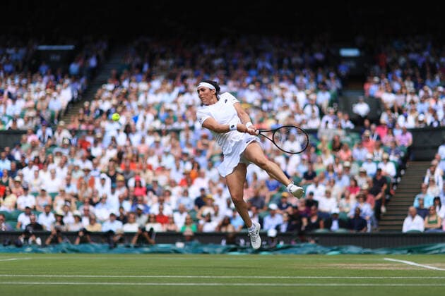 Tennis - Wimbledon (Day 11) 7th July 2022 - Tennis - Wimbledon (Day 11) - Ons Jabeur (TUN) leaps to play a shot against Tatjana Maria (GER) during their Ladies Singles Semi Final match - Photo: Simon Stacpoole Offside. London UK Copyright: xSimonxStacpoolexOffside
