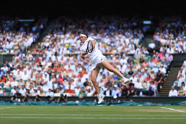 Tennis - Wimbledon (Day 11) 7th July 2022 - Tennis - Wimbledon (Day 11) - Ons Jabeur (TUN) leaps to play a shot against Tatjana Maria (GER) during their Ladies Singles Semi Final match - Photo: Simon Stacpoole Offside. London UK Copyright: xSimonxStacpoolexOffside