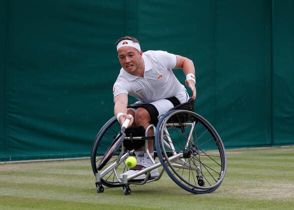 7th July 2022, All England Lawn Tennis and Croquet Club, London, England; Wimbledon Tennis tournament; Alfie Hewett (GBR) plays a forehand to Gordon Reid (GBR) in mens wheelchair quarter-final match  ActionPlus12405629 JohnxPatrickxFletcher