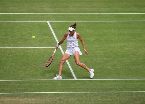 7th July 2022, All England Lawn Tennis and Croquet Club, London, England; Wimbledon Tennis tournament; Tatjana Maria (GER) plays a backhand to Ons Jabeur (TUN) in the womens singles semi-final  ActionPlus12405663 JohnxPatrickxFletcher