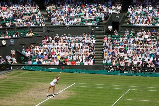 7th July 2022, All England Lawn Tennis and Croquet Club, London, England; Wimbledon Tennis tournament; Tatjana Maria (GER) serves to Ons Jabeur (TUN) in front of a packed Centre Court in the womens singles semi-final  ActionPlus12405679 JohnxPatrickxFletcher