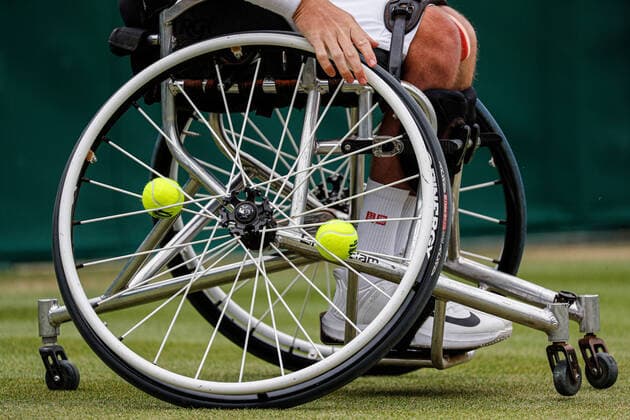 7th July 2022, All England Lawn Tennis and Croquet Club, London, England; Wimbledon Tennis tournament; Tennis balls on the bicycle wheel of Gordon Reid (GBR) in mens wheelchair quarter-final match  ActionPlus12405655 JohnxPatrickxFletcher