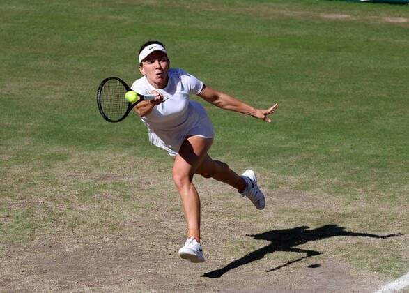 7th July 2022, All England Lawn Tennis and Croquet Club, London, England; Wimbledon Tennis tournament; Simona Halep (ROU) plays a forehand to Elena Rybakina (KAZ) in their womens singles semi-final match  ActionPlus12405729 JohnxPatrickxFletcher