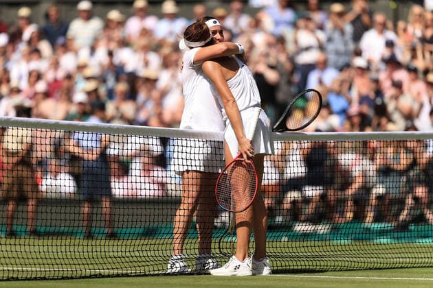Tennis - Wimbledon (Day 11) 7th July 2022 - Tennis - Wimbledon (Day 11) - Ons Jabeur (TUN) and Tatjana Maria (GER) embrace each other at the net after their Ladies Singles Semi Final match - Photo: Simon Stacpoole Offside. London UK Copyright: xSimonxStacpoolexOffside