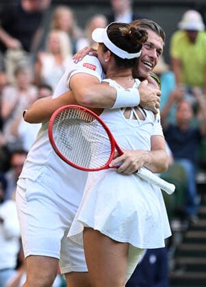 Tennis Championships - Week One - Day Eleven - All England Lawn Tennis Club, Wimbledon - Thursday 7th July 2022 Mixed Doubles Final - Centre Court Neal Skupski (GBR) and Desirae Krawczyk (USA) v Matthew Ebden and Samantha Sposur (AUS) Neal Skupski (GBR) and Desirae Krawczyk (USA) celebrate winning the match 