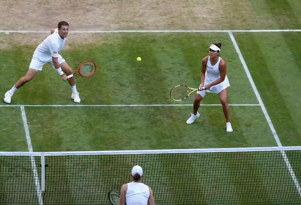 (220708) -- LONDON, July 8, 2022 -- Neal Skupski (L) of Great Britain and Desirae Krawczyk of the United States compete during the mixed doubles final against Matthew Ebden Samantha Stosur of Australia at Wimbledon Tennis Championship in London, Britain, on July 7, 2022. ) (SP)BRITAIN-LONDON-TENNIS-WIMBLEDON-MIXED DOUBLES-FINAL HanxYan 